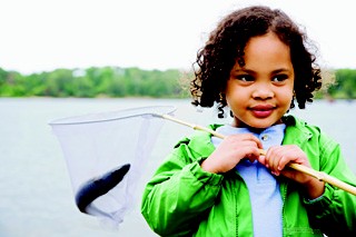 boy catching fish