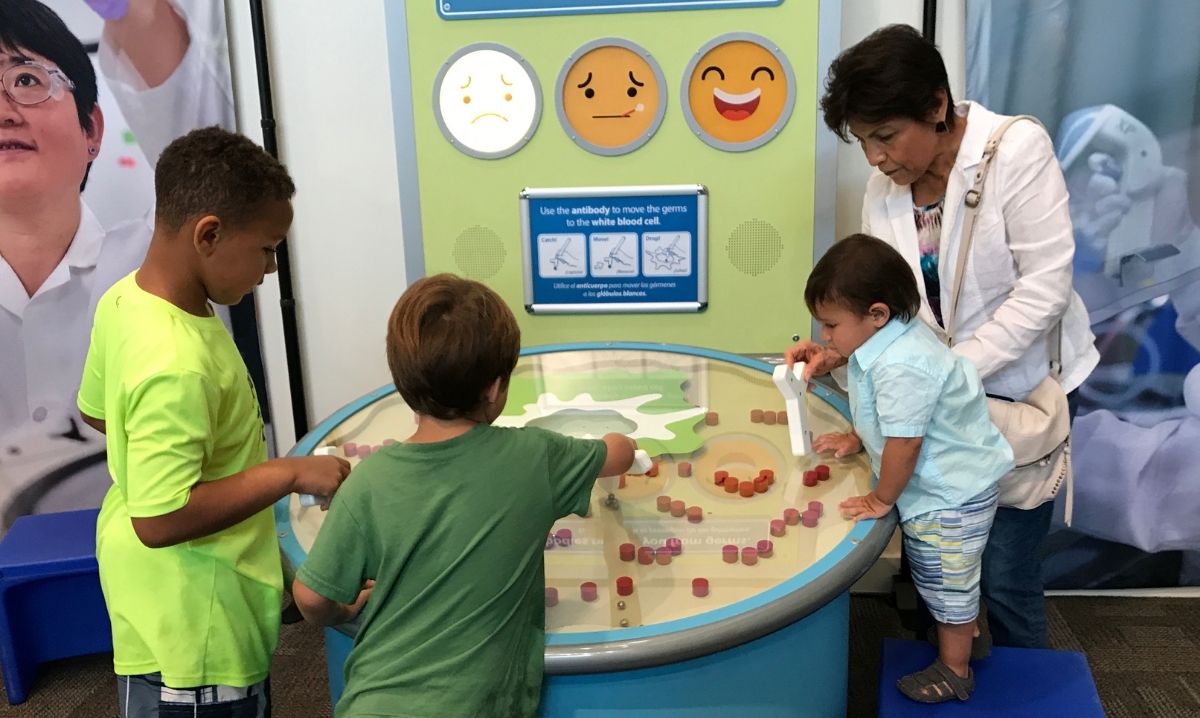 Children engage in a hands-on science experiment at the Science + You exhibit at Kohl Children's Museum, a fun and educational spring exhibit in Glenview.