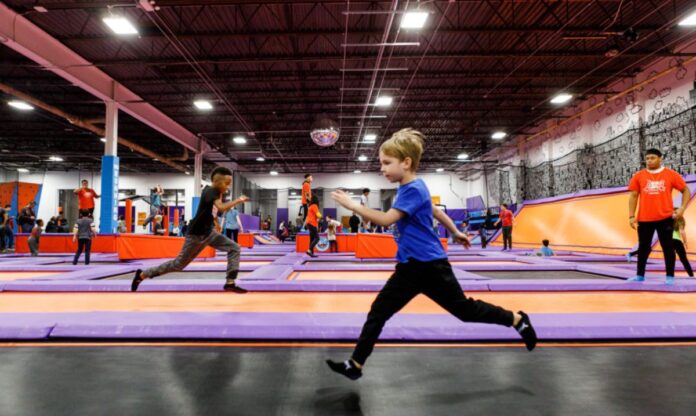 Children running and jumping on trampolines at Altitude, an indoor play place in Chicago, providing a fun and active environment for kids.